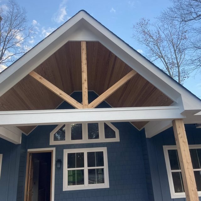 Timber-framed gable on a screened porch